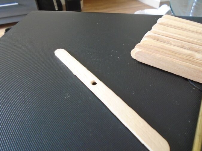 drilling the popsicle sticks